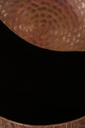 A brass singing bowl without traditional coating, leaving the metal piece with naked surface, natural burn marks and unique reddish due to burning reaction.
